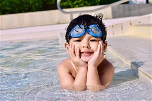 Cute Toddler Laying On The Pool Steps